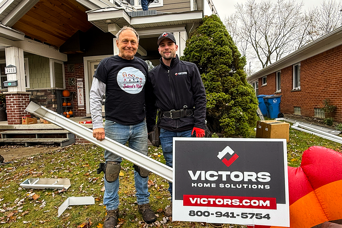 Tom and roof inspection Jake standing in front of Tom's house