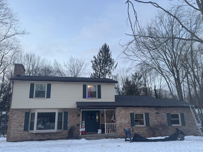 Roof repair on a home in Saginaw, Michigan